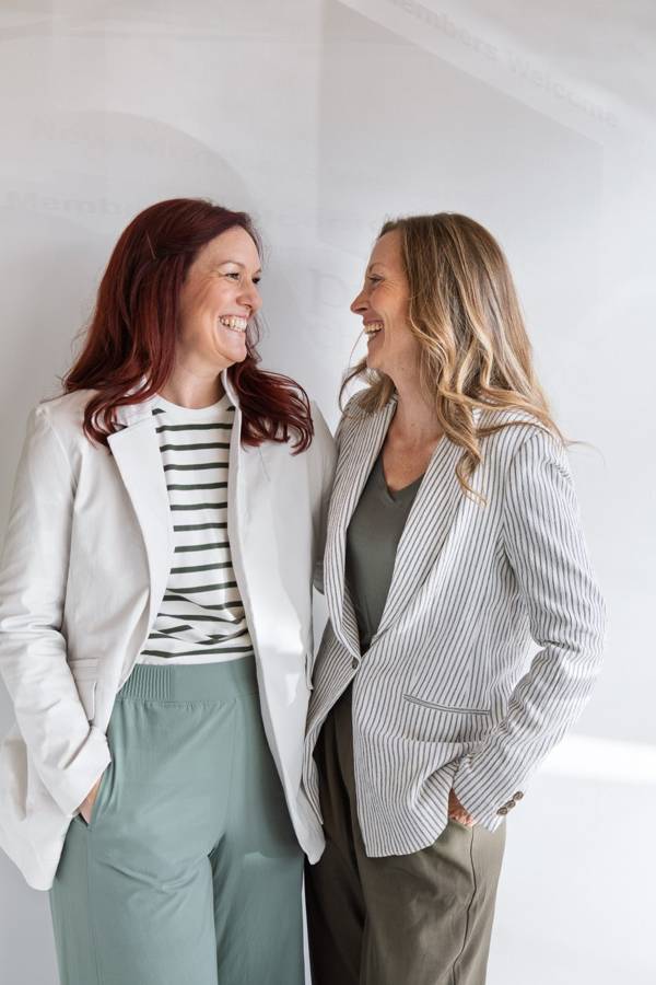 Dr. Sarah Simison and Dr. Nicole Craze laughing together in the clinic