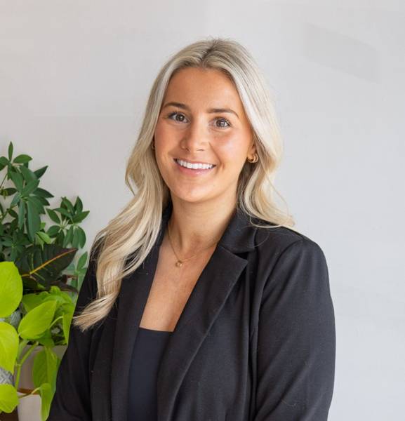 Olivia Ferguson, naturopath, smiling in the clinic